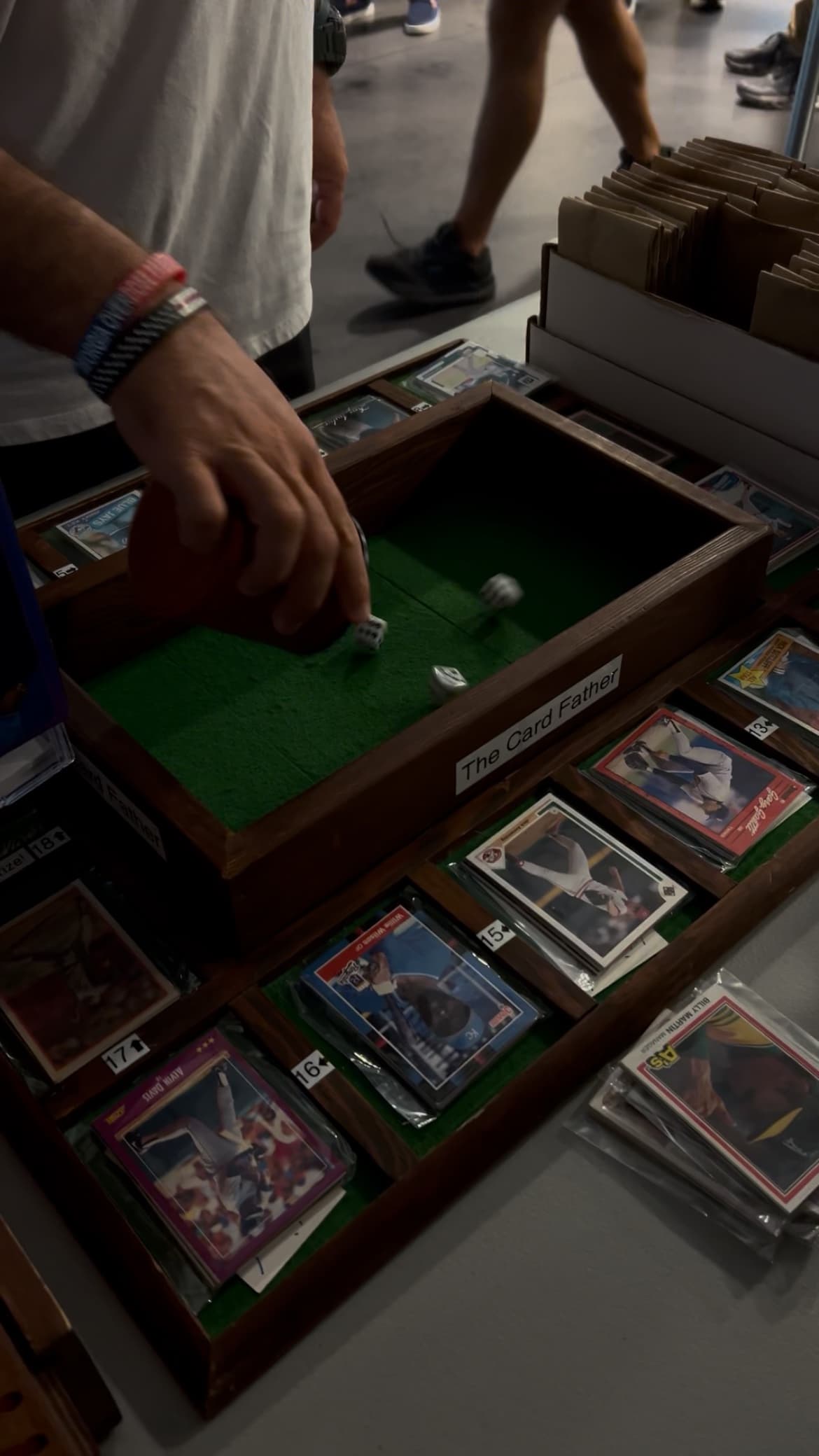 The dice game board set up with sports cards laid out.