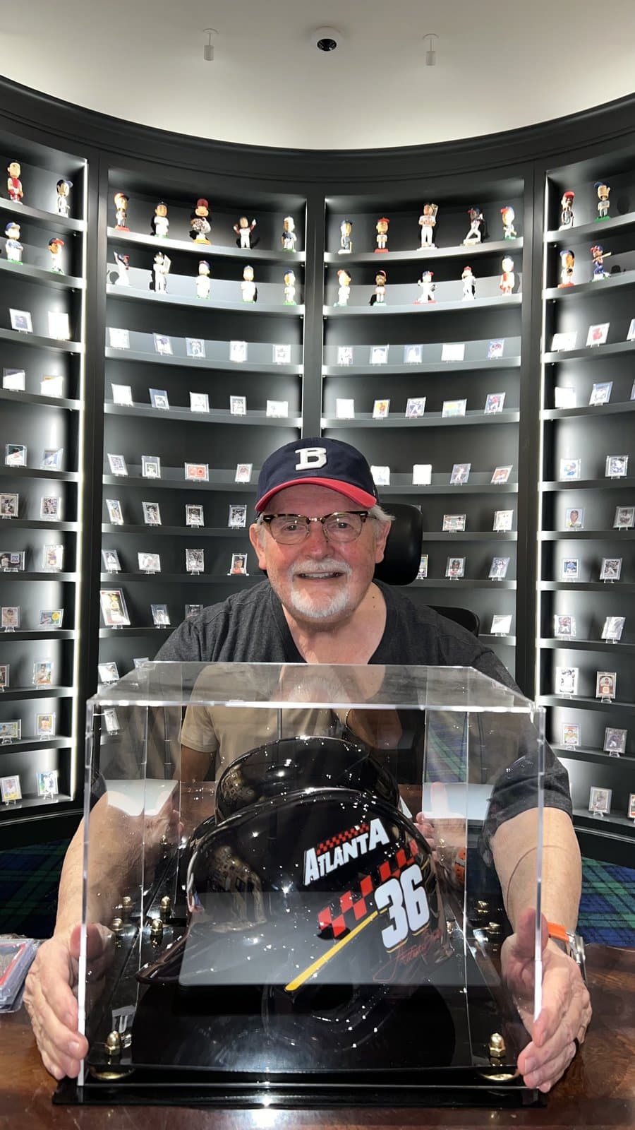 The CardFather holding a display case from his collection.