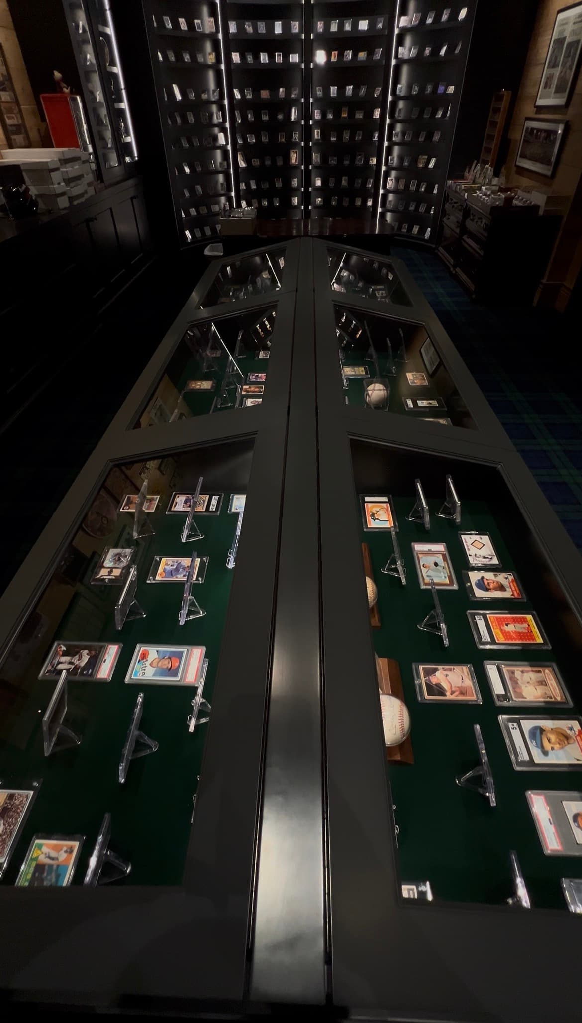 The card room, shelves of boxed and graded sports cards.